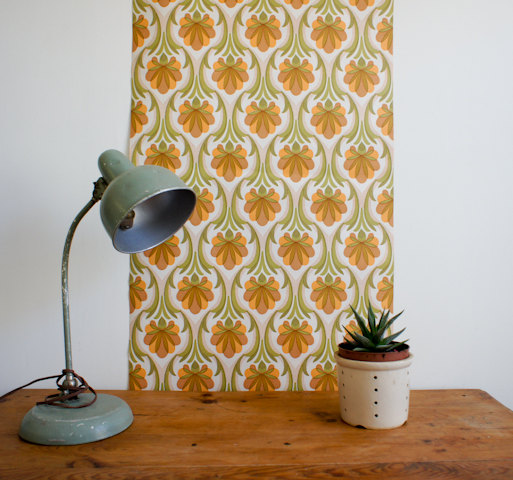  1970's french wallpaper with geometric flower design in greens, browns and orange, full roll